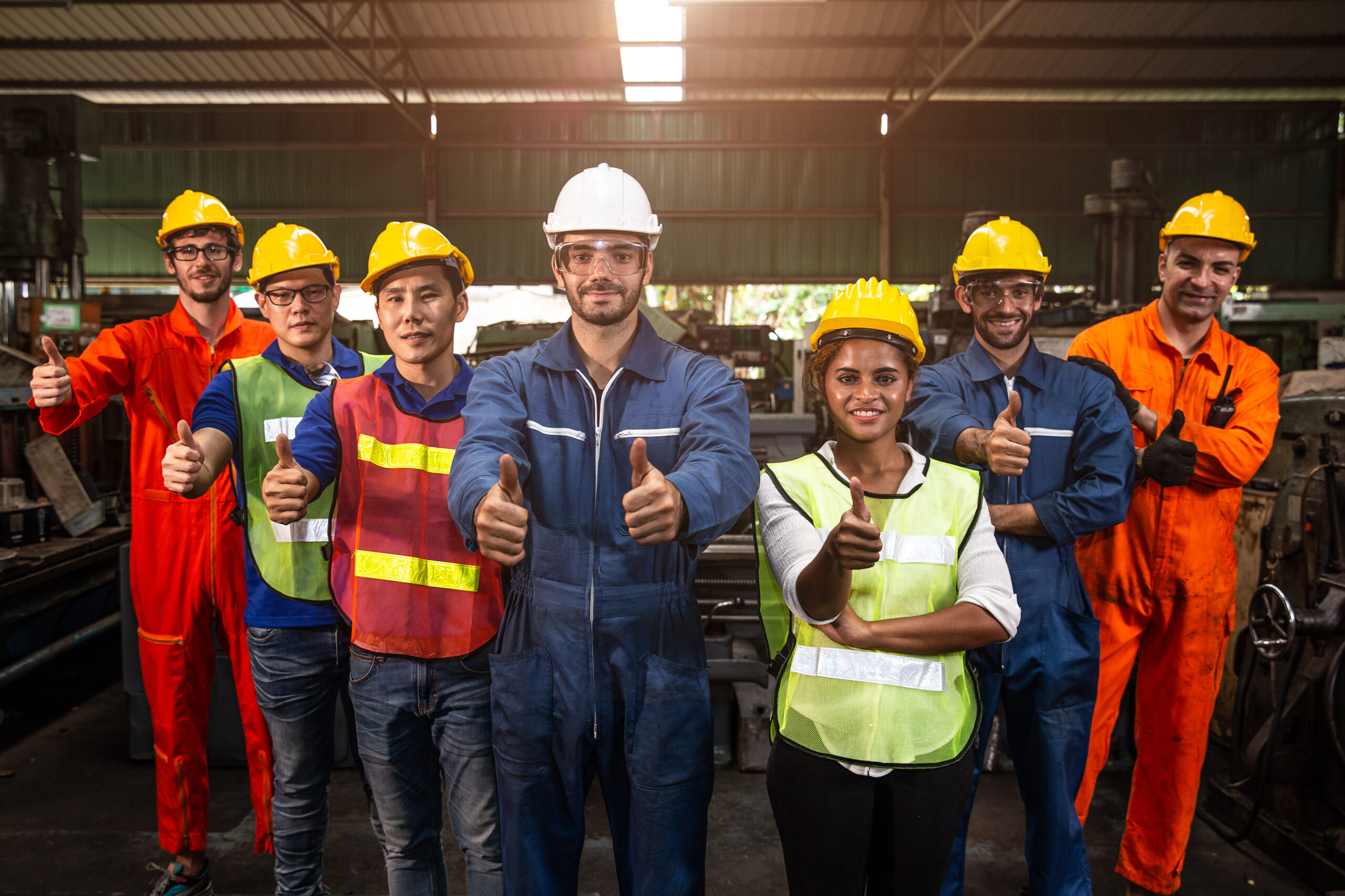 Group of Team Worker mix race  enjoy working in heavy factory standing together smiling happy hand show thumbs up wide banner.